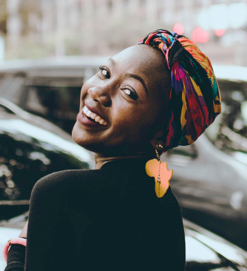 African Woman Looking back and Smiling